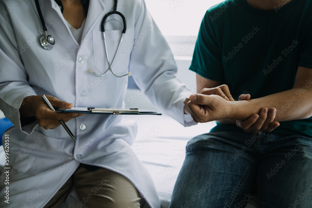 Male patient having consultation with doctor or psychiatrist who working on diagnostic examination on men's health disease or mental illness in medical clinic or hospital mental health service center