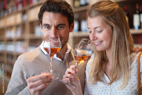 Vászonkép close up portrait of young couple at wine tasting