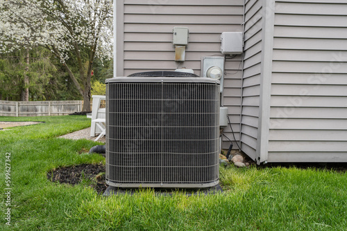 air conditioner condeser unit and system has been installed in a backyard