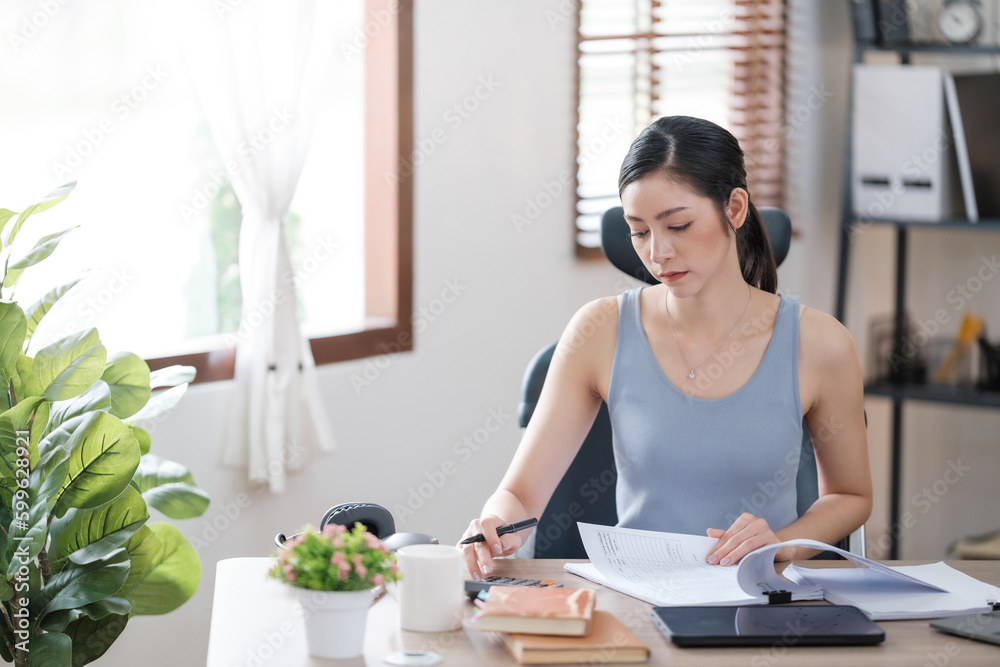 Beautiful Asian young woman wear casual working with social media.Freelance woman working online sale marketing. Shopping online at home. Beautiful Asian young woman wear casual working with social media.Freelance woman working online sale marketing. Shopping online at home.