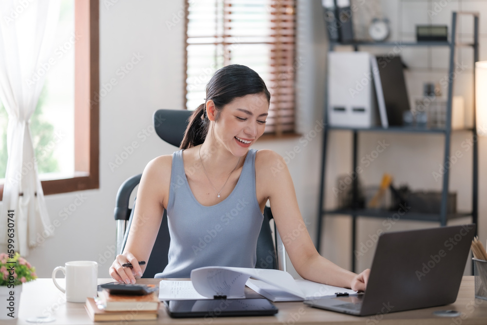 Beautiful Asian young woman wear casual working with social media.Freelance woman working online sale marketing. Shopping online at home. Beautiful Asian young woman wear casual working with social media.Freelance woman working online sale marketing. Shopping online at home.