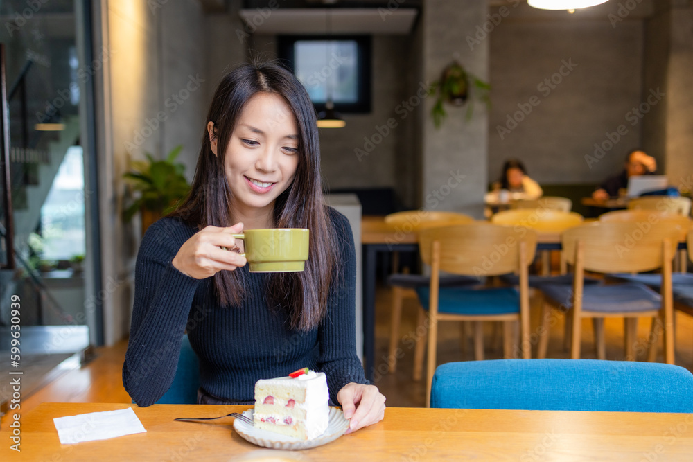 Woman enjoy her cake in coffee shop Woman enjoy her cake in coffee shop