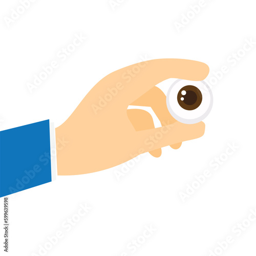 Human hand holding an eyeball