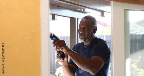 Caulking Gun African-American Senior Man Static