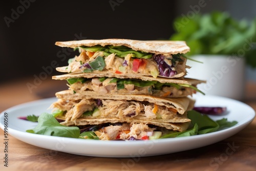 stack of warm tortillas with creamy tuna salad and crisp veggies, created with generative ai
