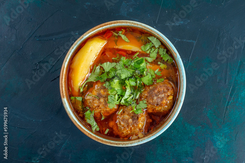 top view meat soup with meatballs greens and sliced potatoes on dark-blue desk food soup sauce vegetable dish