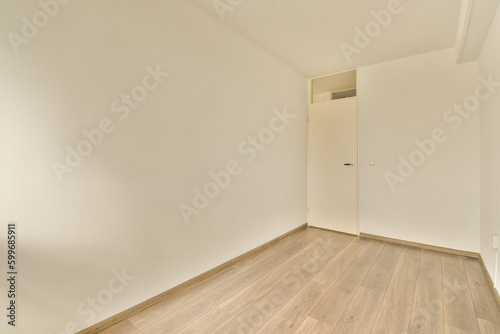 Wallpaper Mural an empty room with white walls and wood flooring on the right side, there is a door in the corner to the left Torontodigital.ca