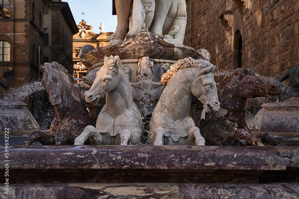 Detail of horses of the Neptune fountain, in Florence, Italy at dusk.