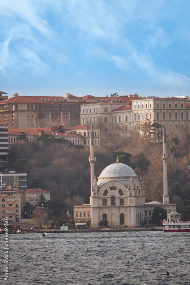 historic architecture mosque and ferry on river in istanbul 
