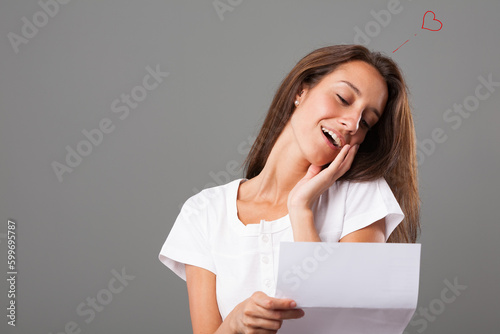 Tender woman, touched by love letter