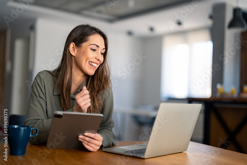 Confident businesswoman executive coach in casual clothes using laptop computer, having video conference call virtual meeting, professional training negotiation, remote working from home.