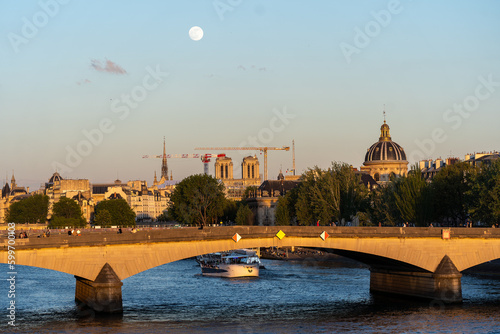 Moon over Paris at sunset