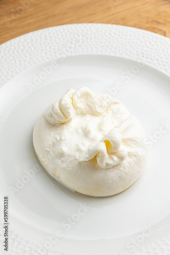 delicious buratta cheese on a white plate
