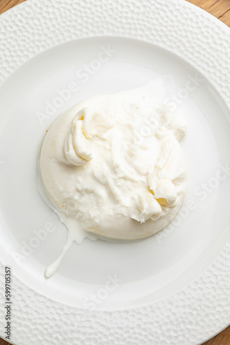 delicious buratta cheese on a white plate
