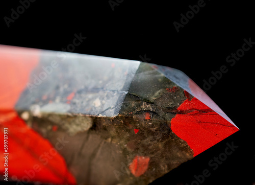 Close up of a Bloodstone Jasper mineral specimen cut into an Oblelisk photo