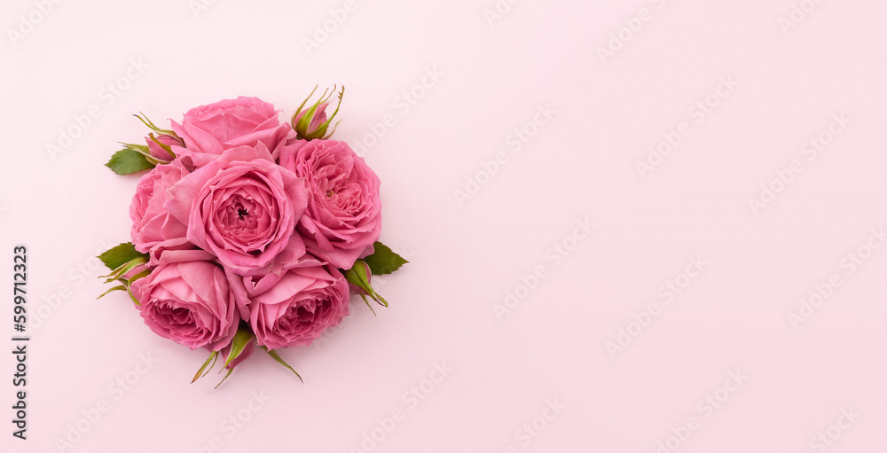 Flower ball of roses on a pastel background. Greeting card or invitation mockup. Place for text. Selective focus.