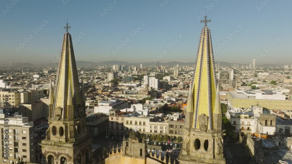 Scenic architecture aerial of historical Mexican landmark in golden sun light 4K. Cinematic close up view on gothic towers and architecture decor elements of main cathedral in Guadalajara, Mexico Scenic architecture aerial of historical Mexican landmark in golden sun light 4K. Cinematic close up view on gothic towers and architecture decor elements of main cathedral in Guadalajara, Mexico