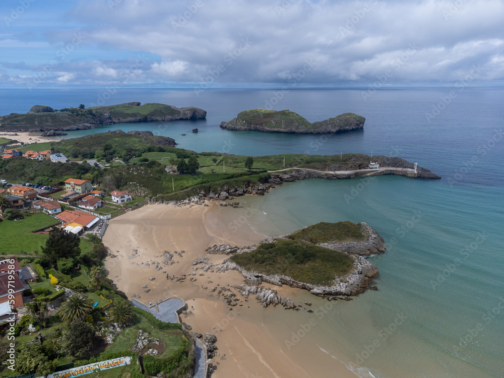 Aerial view on Playa de Palombina, Las Camaras and Celorio, Green coast of Asturias, North Spain with sandy beaches, cliffs, hidden caves, green fields and mountains.