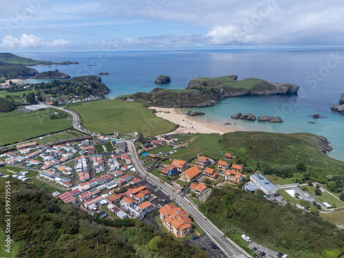 Aerial view on Playa de Borizo and Celorio, Green coast of Asturias, North Spain with sandy beaches, cliffs, hidden caves, green fields and mountains.