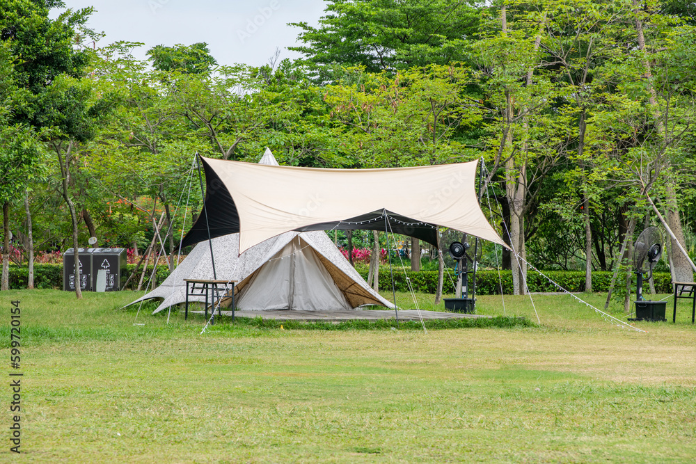 Camping tents on green grass in the park
