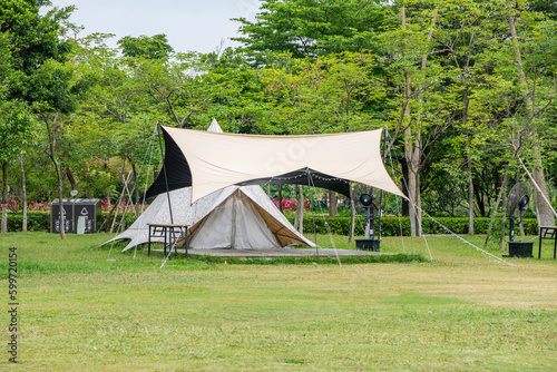 Camping tents on green grass in the park