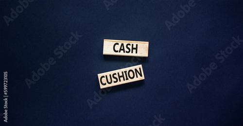 Cash cushion symbol. Concept words Cash cushion on beautiful wooden block. Beautiful black table black background. Business and Cash cushion concept. Copy space.