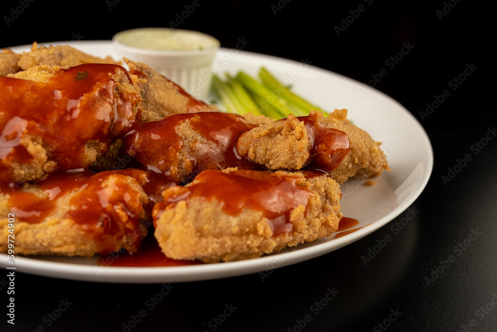 Petisco - Chicken wing seasoned and breaded with sour cream and spicy sauce