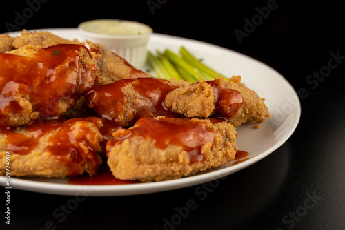 Petisco - Chicken wing seasoned and breaded with sour cream and spicy sauce
