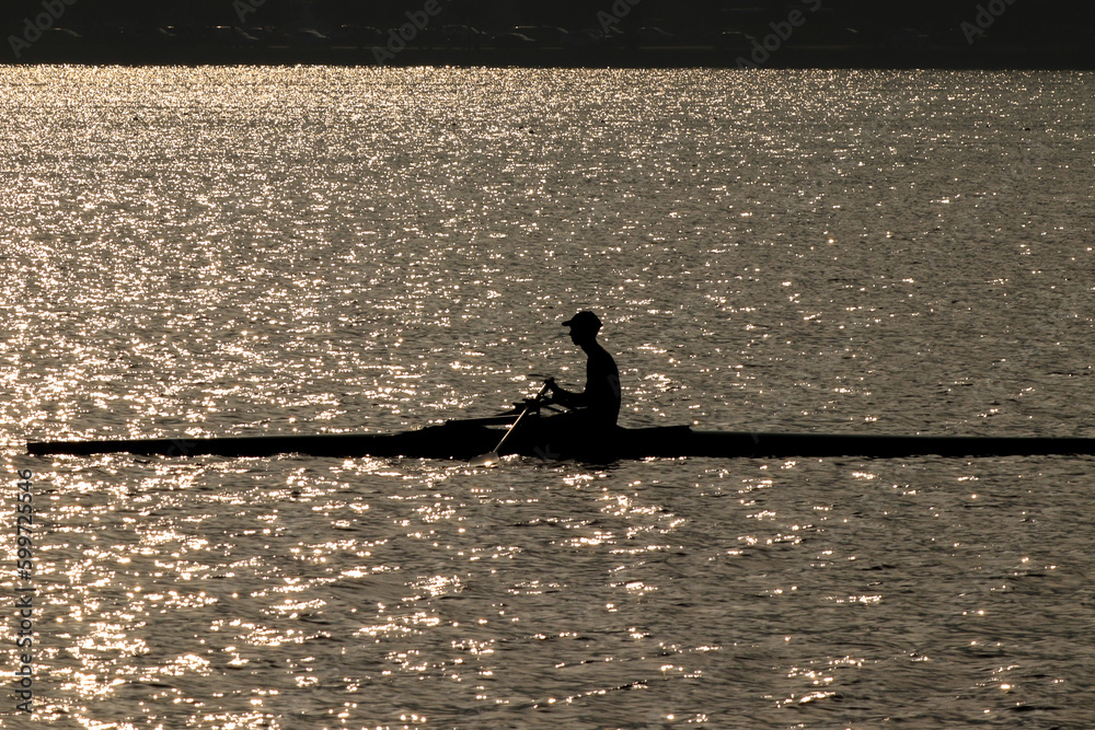 Rio de Janeiro, RJ, Brazil, 05.05.2023 - Rowers in silhouette rowing in the Rodrigo de Freitas Lagoon