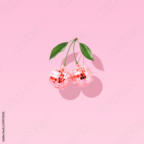 Modern retro composition made of decorative disco balls like cherries on a pastel pink background Fototapet