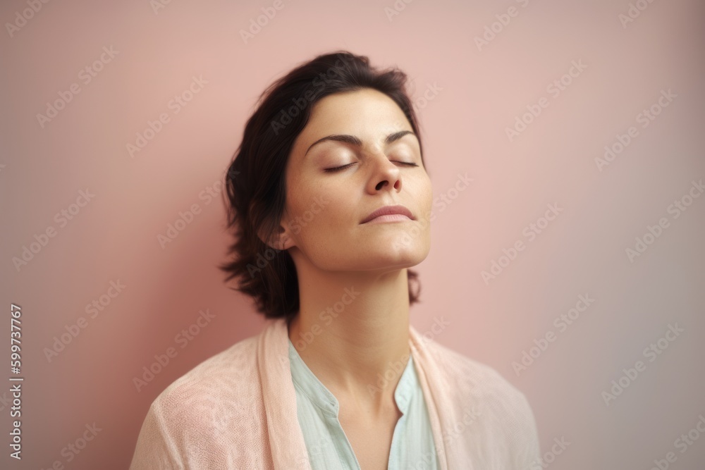 Portrait of a beautiful woman with closed eyes on a pink background Portrait of a beautiful woman with closed eyes on a pink background