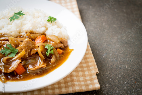 Japanese curry rice with sliced pork, carrot and onions