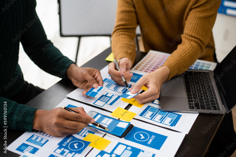 Fototapeta premium Creative digital development agency. UX graphic designer planning application process development prototype wireframe for web smart phone.