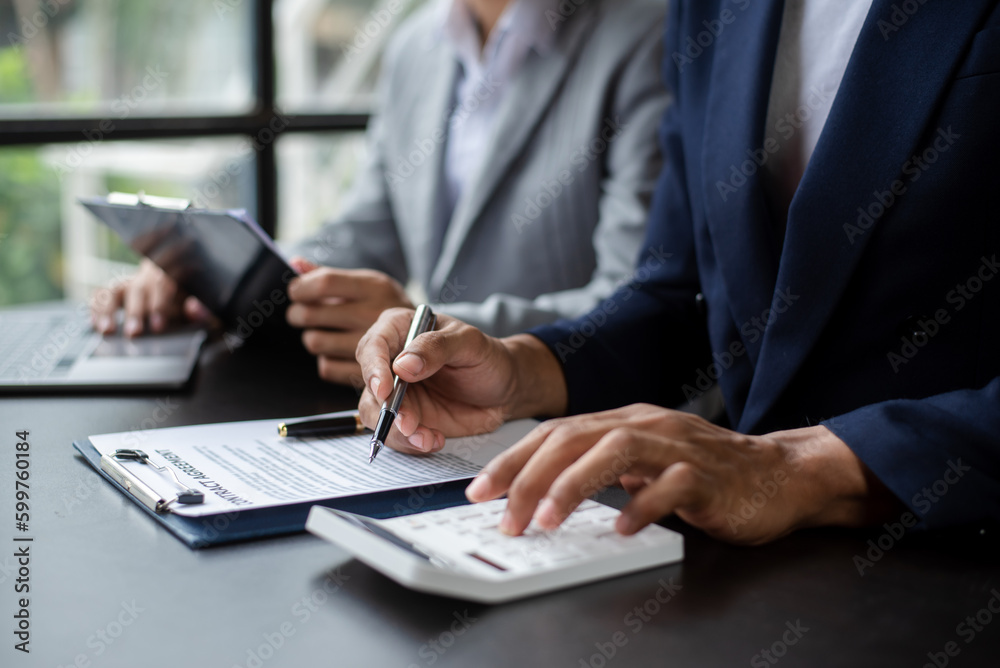 Real estate broker agent presenting and consult to customer to decision making sign insurance form agreement, home model, concerning mortgage loan offe Real estate broker agent presenting and consult to customer to decision making sign insurance form agreement, home model, concerning mortgage loan offe