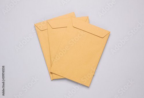 Craft postal envelopes on a gray background