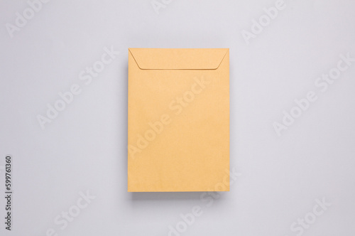 Craft postal envelope on a gray background