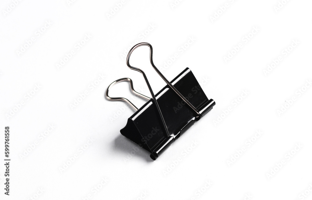 Black binder paper clip on gray background. Business concept Black binder paper clip on gray background. Business concept
