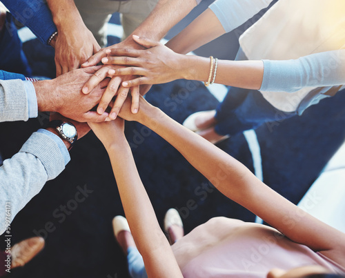 Business people  hands together and office worker group with support  motivation and solidarity gesture. Above  hand in and success of teamwork and staff with workplace community and achievement