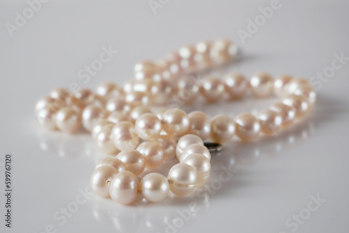 Beautiful White Pearls necklace on white background,