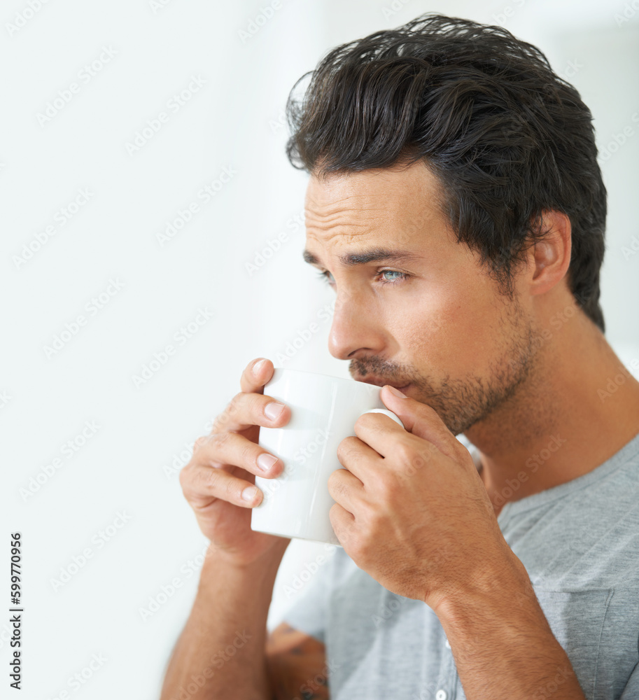 Wake up, morning and a man drinking coffee from a mug in his home alone on the weekend to relax. Face, thinking and caffeine with a handsome young male model enjoying a fresh beverage in his house Wake up, morning and a man drinking coffee from a mug in his home alone on the weekend to relax. Face, thinking and caffeine with a handsome young male model enjoying a fresh beverage in his house