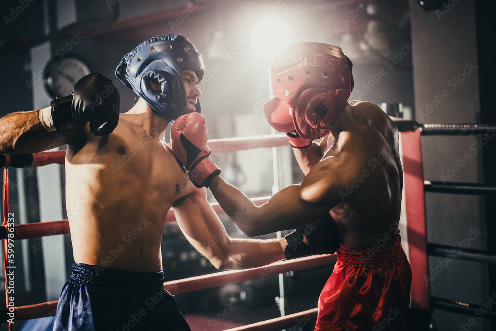 Boxer use various punch combinations, including the jab, hook, uppercut, cross, swing, straight. Getting in close to make opponent on ropes and knockout. Boxing champions win the round in boxing ring - obrazy, fototapety, plakaty 