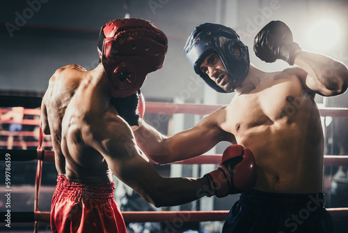 Boxer use various punch combinations, including the jab, hook, uppercut, cross, swing, straight. Getting in close to make opponent on ropes and knockout. Boxing champions win the round in boxing ring