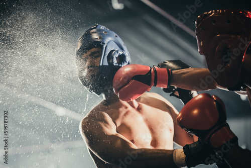 Tableau sur toile Boxer use various punch combinations, including the jab, hook, uppercut, cross, swing, straight