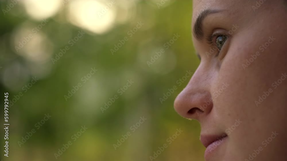 Close up portrait of pleased relaxed young woman sitting on windowsill on background spring forest during sunset or sunrise, happy caucasian female at home smiling gently, enjoying beautiful nature Close up portrait of pleased relaxed young woman sitting on windowsill on background spring forest during sunset or sunrise, happy caucasian female at home smiling gently, enjoying beautiful nature