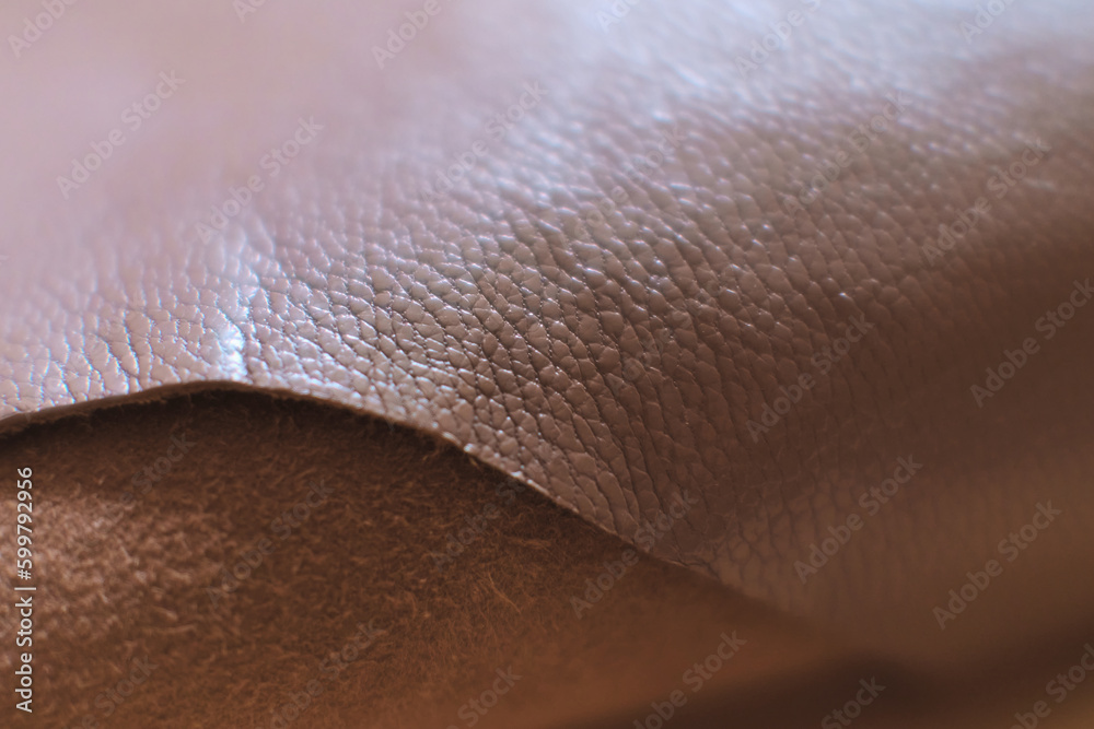 Fototapeta premium detailed view of a luxurious brown leather piece, highlighting the intricate patterns and natural feel. Timeless Elegance