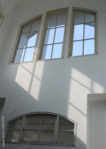 classic white windows with sunlight reflection
