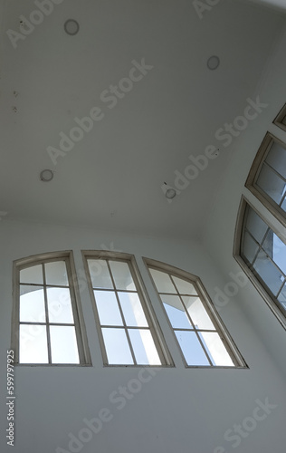 classic white windows with sunlight reflection