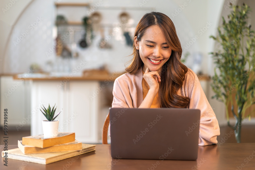 Young smiling asian woman relax using laptop conference work, learning, education, study online, webinar podcast, student girl looking at screen typing message with computer at home Young smiling asian woman relax using laptop conference work, learning, education, study online, webinar podcast, student girl looking at screen typing message with computer at home