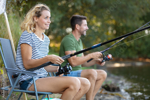 a young couple is fishing