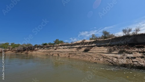 Exploring the natural beauty of Madagascar's Kivalo region with a scenic boat trip. Rocking boat and tranquil river. Madagascar wilderness landscape photo
